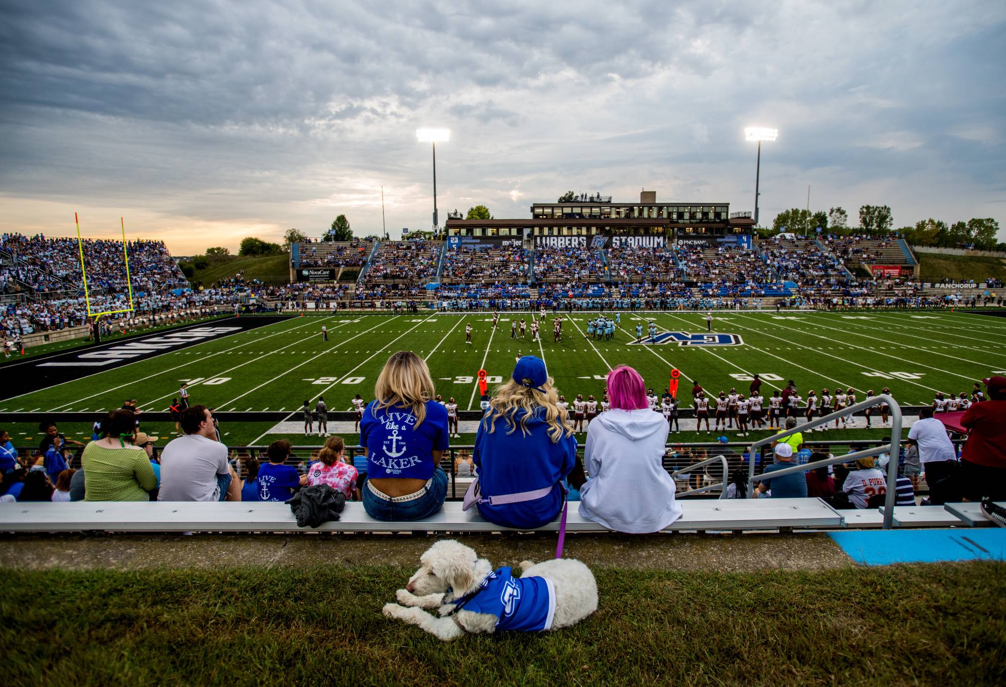 Fans cheer on the GVSU Football team in Lubbers Stadium at dusk